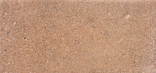 The texture of the brick is coarsely enlarged