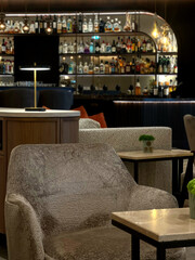 Abstract interior design in a hotel lobby with a bar in the background 