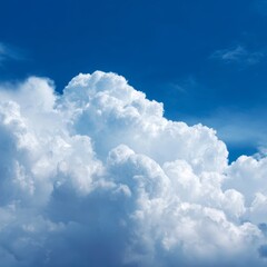 Naklejka premium Fluffy white clouds against a vibrant blue sky