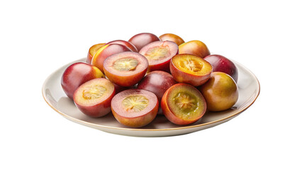Platter of fresh whole and halved tamarillo fruits, ready to eat