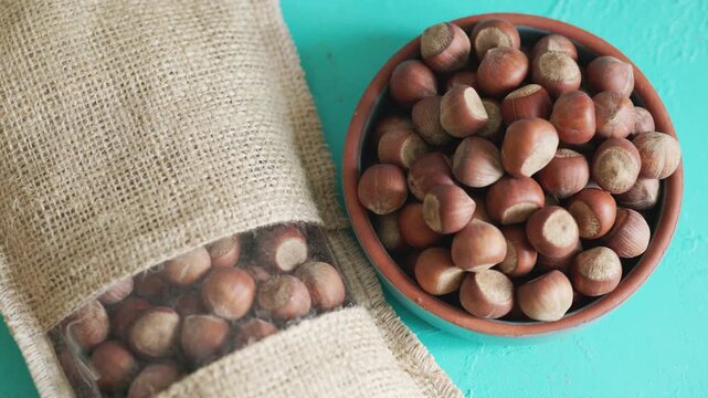 Fresh Turkish hazelnuts in shell in bowl in close-up