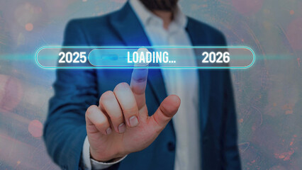Close-up of businessman touching futuristic digital loading bar interface with neon blue years 2025–2026, glowing progress indicator, and high-tech professional atmosphere