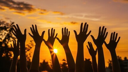 A sunrise with hands reaching up in joy