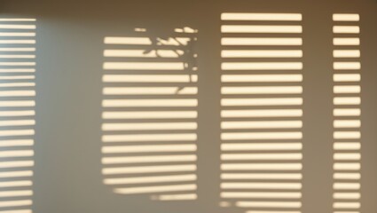 Fototapeta premium Light and shadow patterns created by window blinds.