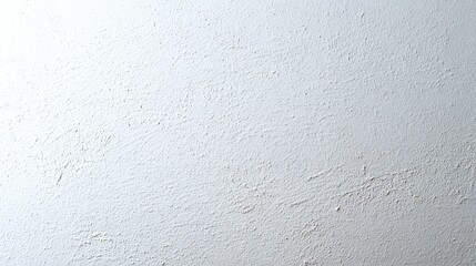 Obraz premium A close-up of a textured white wall with a slightly rough surface,