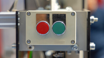 Red and Green Push Buttons Start Stop Control Box at Industrial Machine