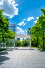 Naklejka premium Modern minimalist architecture with glass walls and white structure surrounded by lush green trees and tall buildings under blue sky