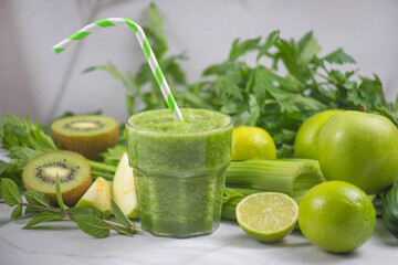 Refreshing green smoothie with fresh greens and citrus fruits