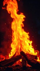 Intense, vibrant flames engulfing a dark background, creating a dramatic display of fire's raw power and energy Perfect for projects needing a fiery, intense visual , orange, night