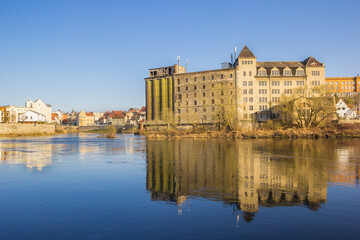 Hydroelectric power station with reflection in the Saale river in Bernburg, Germany