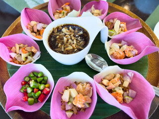 Colorful Thai Dish with Assorted Ingredients in Petal Bowls