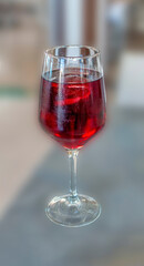 VIEW GLASS OF SUMMER RED WINE WITH ICE