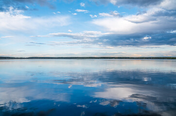 Blue lake with cloudy sky, natural background