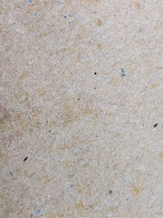 Macro textured closeup of recycled rough brown paper background