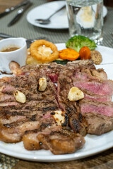 Grilled Steak Platter with Vegetables and Sauce