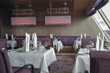 Formal and elegant a la carte ocean view dining room restaurant onboard luxury cruiseship or cruise...