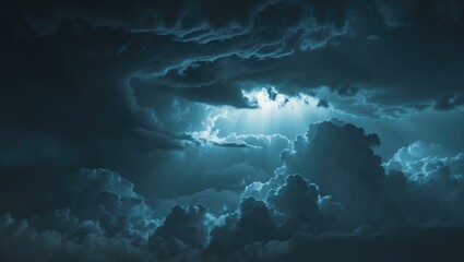 Dark storm clouds with a break in the sky letting light shine through. Nature and weather, concept. Atmospheric and stormy weather. The concept of weather patterns and atmospheres.