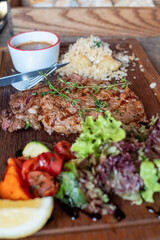 Grilled Steak Platter with Fresh Vegetables and Sauce