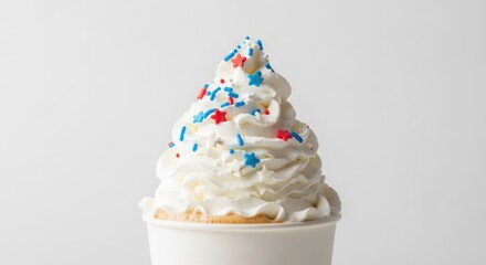 Whipped Cream Dessert with Red and Blue Star Sprinkles in White Cup on White Background