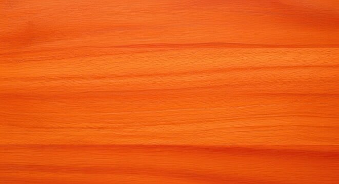 Padauk wood surface Vibrant orange-red color with fine pores and a satin finish, seamless tileable