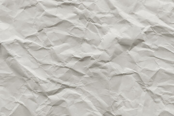 Crumpled offwhite paper with wrinkles. Suitable for backgrounds, texture designs, or symbolizing creativity and artistic expression in design projects.