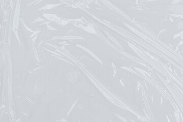 Crumpled white plastic wrap with wrinkles, suitable for packaging product designs, recycling concepts, and ecofriendly graphics for digital projects.