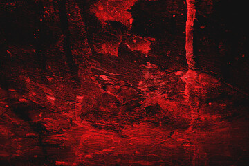 Dark picture of redlit cave walls, rocks, possible stalactites. Suitable for backgrounds, spooky themes, environmental concepts, and adventure designs.