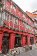 Fototapeta premium Old red house in the town of Ribe, the oldest town in Denmark. Half-timbered and barred windows 2021