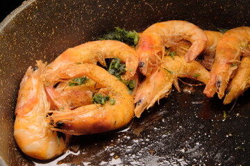 Sizzling Shrimp in Cast-Iron Skillet, Garnished with Fresh Herbs vibrant green parsley