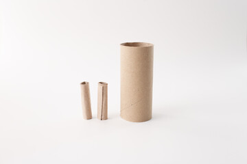 Cardboard tubes on white background for eco packaging, recycling, sustainability, craft, or DIY business visuals