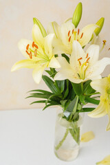 Yellow  lilies in glass vase – perfect for natural home decor or minimalist floral stock themes