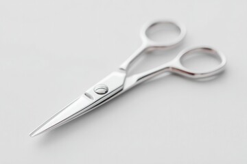 Obraz premium Shiny scissors resting on smooth surface, showcasing sleek desig