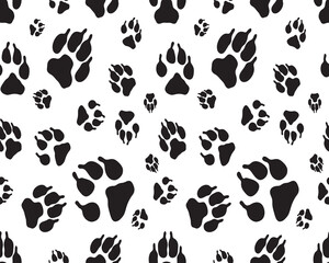 Black silhouettes of prints of dog paws, Seamless pattern	