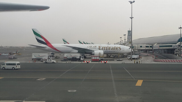 Dubai, United Arab Emirates - March 13, 2016 - View of the ramp at DXB Airport (Dubai) and Emirates Airlines planes from the ramp of this airport