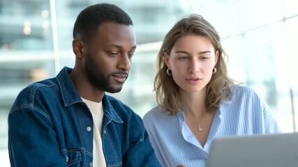 Modern office setting with a multicultural team collaborating on data analysis representing digital transformation, business teamwork, collaboration, corporate strategy, innovation - Powered by Adobe