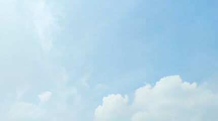 Blue sky with clouds. Blue sky with fluffy white cumulus clouds on a sunny day. The clouds were white and bright, creating a calm and peaceful atmosphere. Nature background.