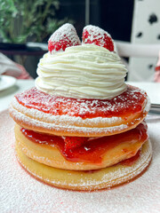 Delicious Strawberry Pancakes with Whipped Cream Topping
