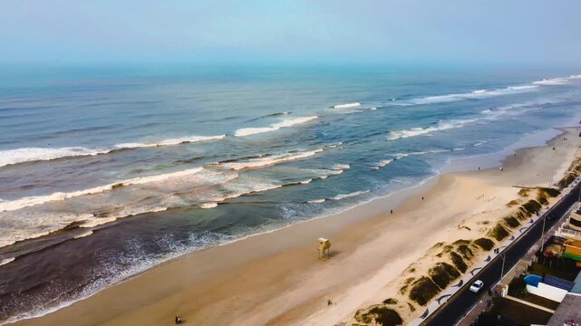 Aerial drone view of Cap&atilde;o da Canoa beach, Rio Grande do Sul, Brasil