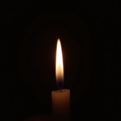 Solitary flame glowing amidst black void