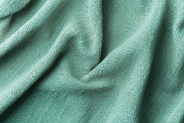 Wrinkled mint  eco fabric texture background close up cotton textile