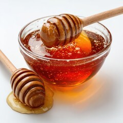 Honey pot and dipper on white background.