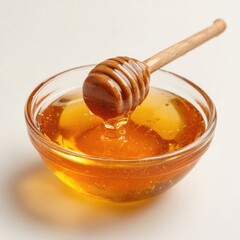 Honey pot and dipper on white background.