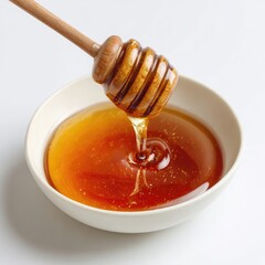 Honey pot and dipper on white background.