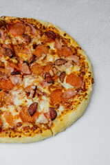 Delicious pepperoni and sausage pizza on a white background ready to be enjoyed