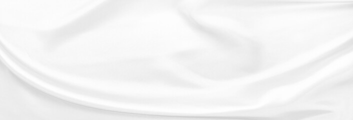 White gray satin texture that is white silver fabric silk background with beautiful soft blur...