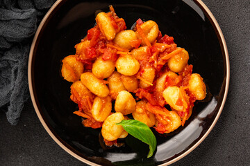 Gnocchi tomato sauce fresh delicious gourmet food background on the table  rustic food top view copy space