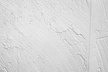 Textured white wall with subtle patterns and variations in lighting and shadow