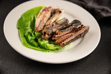 Sardine canned food sprats fish seafood fresh pescetarian diet gourmet food background on the table rustic food top view copy space keto and paleo diet