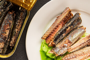 Sardine canned food sprats fish seafood fresh pescetarian diet gourmet food background on the table rustic food top view copy space keto and paleo diet