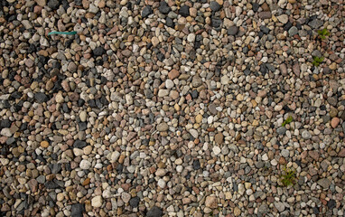 pebble stone background a large number of colorful sea pebbles on the ground create a stone carpet